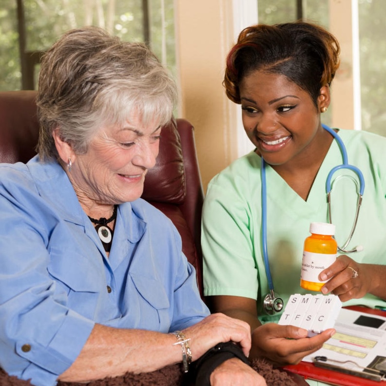 Caregiver providing medication reminder support
