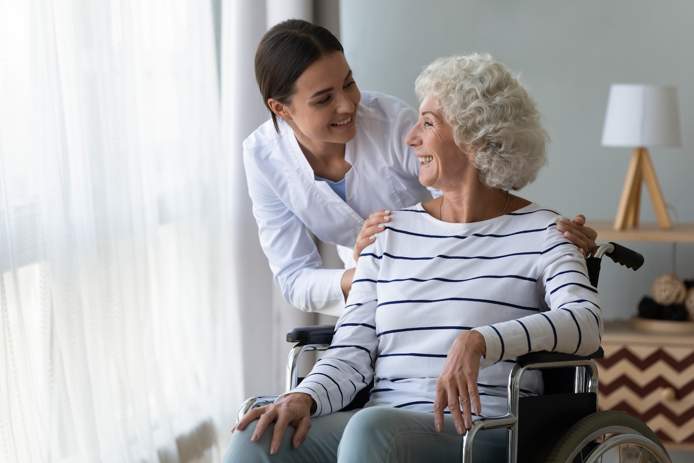 A Trinity caregiver sharing a warm, genuine moment with a senior client